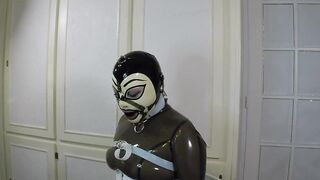 Trailer miss Maskerade Bound in Full Rubber Latex Catsuit