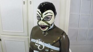 Trailer miss Maskerade Bound in Full Rubber Latex Catsuit