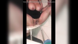 Busty lady squirts in the tub while smoking