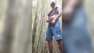 man alone in the woods peeing and relaxing