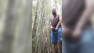 man alone in the woods peeing and relaxing