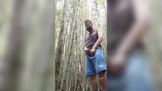 man alone in the woods peeing and relaxing