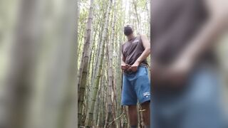 man alone in the woods peeing and relaxing