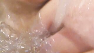 Bathtub fun- letting the water flick my clit and nipples