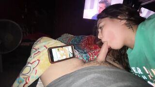 Watching porn and sucking his dick