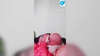 Watch nasty Susi lying on back playing with toy between tits