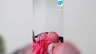 Watch nasty Susi lying on back playing with toy between tits