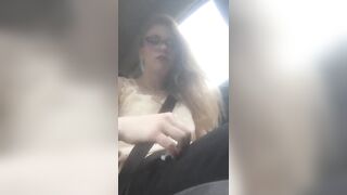 Beautiful junkie doing a shot in the car