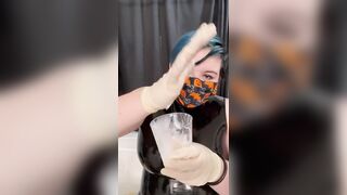 Girl in latex plays with cum