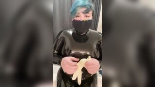 Latex catsuit and latex gloves