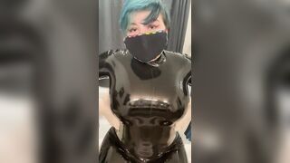 Latex catsuit and latex gloves