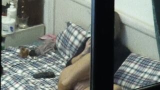 Hot girl masturbating on bed voyeur window