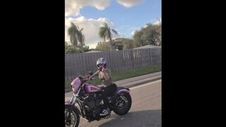 Bonnie public flashing while riding motorcycle