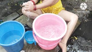 Indian bhabhi bathing outside with