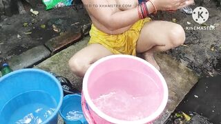 Indian bhabhi bathing outside with