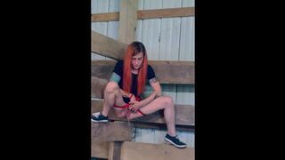 Hot redheaded piss queen, pisses while hanging from a barn stall