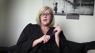 Mature Teacher confiscates a glass dildo and uses it.