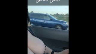 Sexy MILF Darcie Dean driving in traffic with her big tits out.