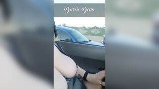 Sexy MILF Darcie Dean driving in traffic with her big tits out.